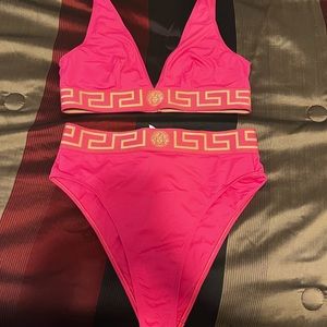 Authentic versace swim suit. Size 5. fits like a M/L.